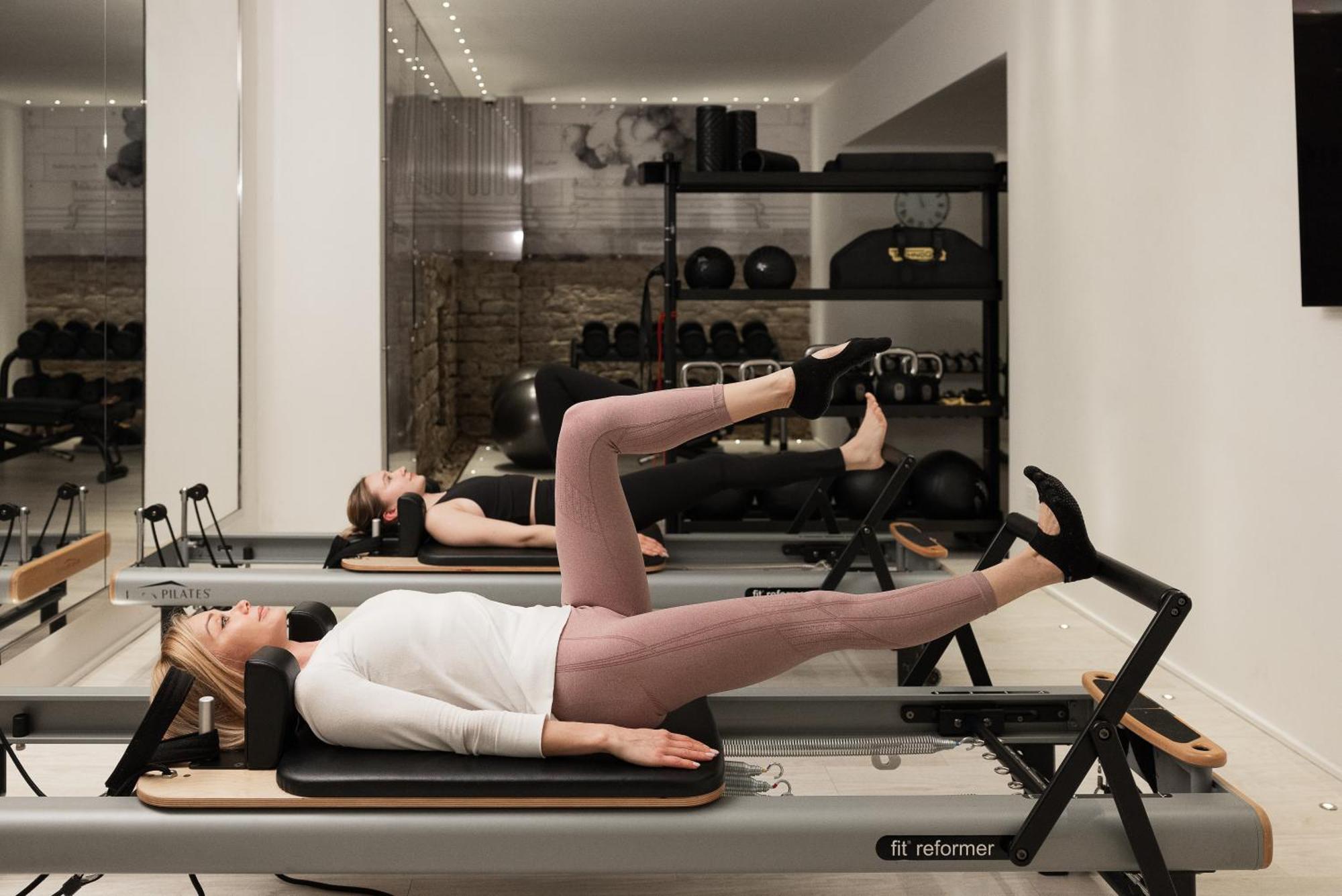 Helvetia&Bristol Firenze - Starhotels Collezione Экстерьер фото A woman using a Pilates reformer